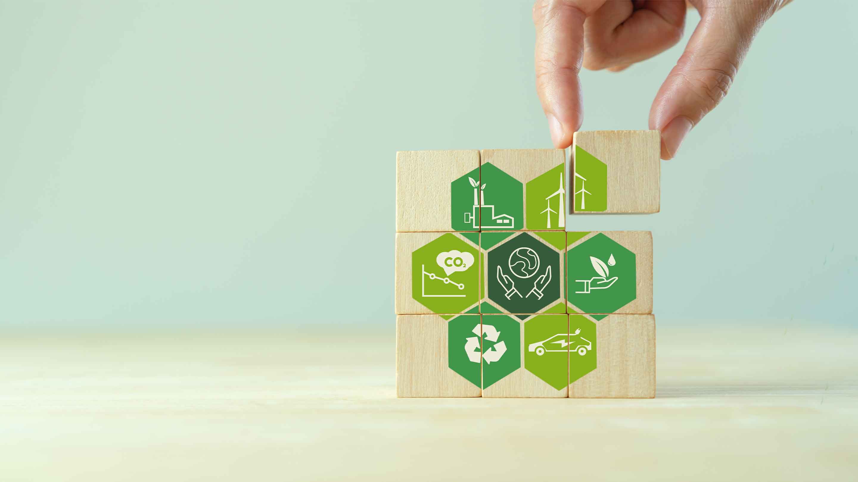 Wooden jigsaw highlighting the key points of sustainability.